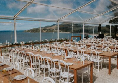 Clear Wedding Marquee hire for Coromandel, Hauraki and Waikato. White Bentwood chairs and wooden tables