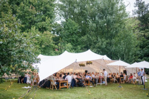 Stretch Tent Wedding Celebration illuminated with lights at night