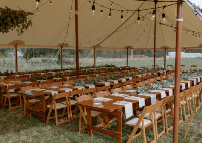 Pauanui marquee wedding with wooden table & chair hire inside a Hampton Marquee