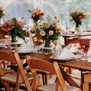 Wedding Table decoration and centrepiece with wooden table and chairs